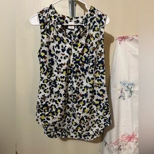 CAbi Black and White Sleeveless Blouse with V-Neck And High Low Hem
